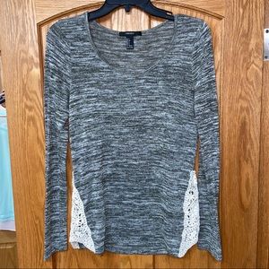 Knit long sleeve top with crotchet detail at waist